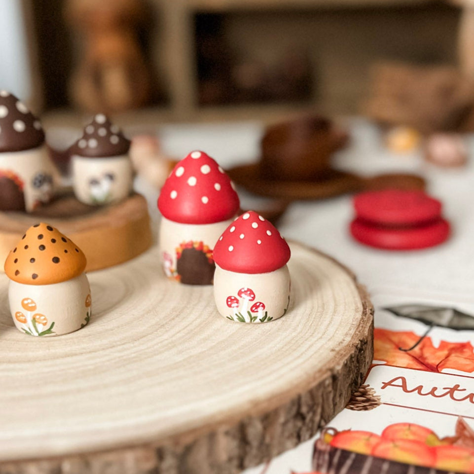 Autumn-themed decorative items on a wooden surface with a blurred background