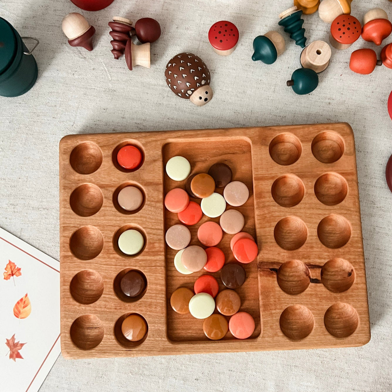 Wooden puzzle game with colorful wooden pieces on a light surface