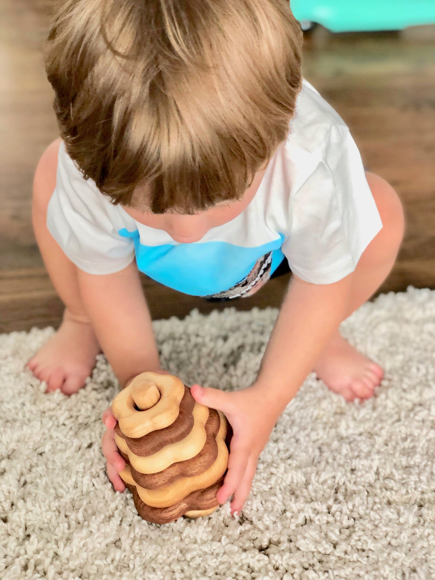 Wooden stacking toy in flower shape from 2 types of wood