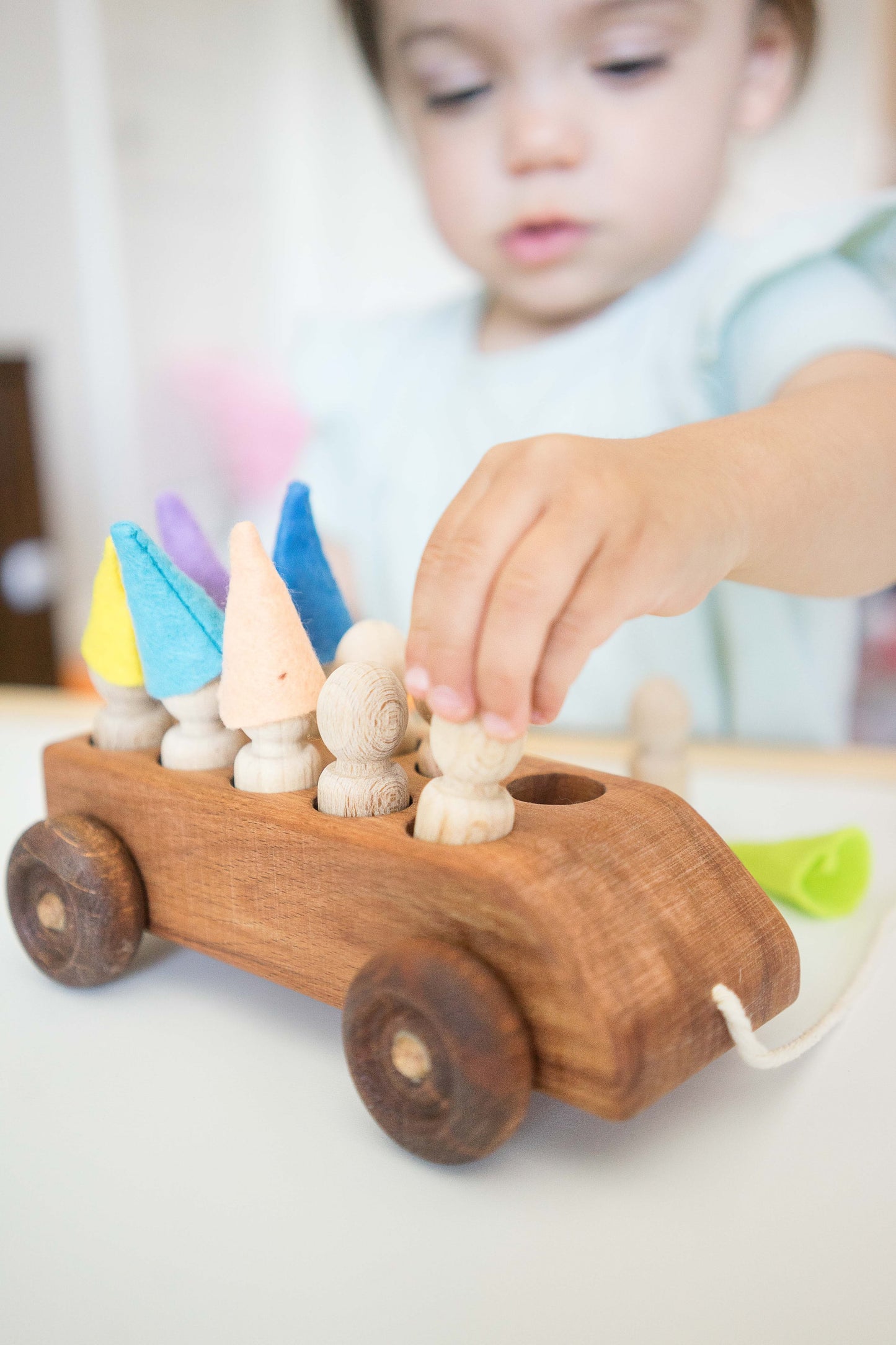 Wooden Toy Car with ten Pegs in Multi-Colored Hats